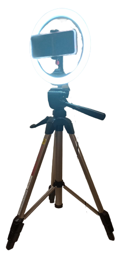 Tripod with ring light and mobile phone mounted onto it.