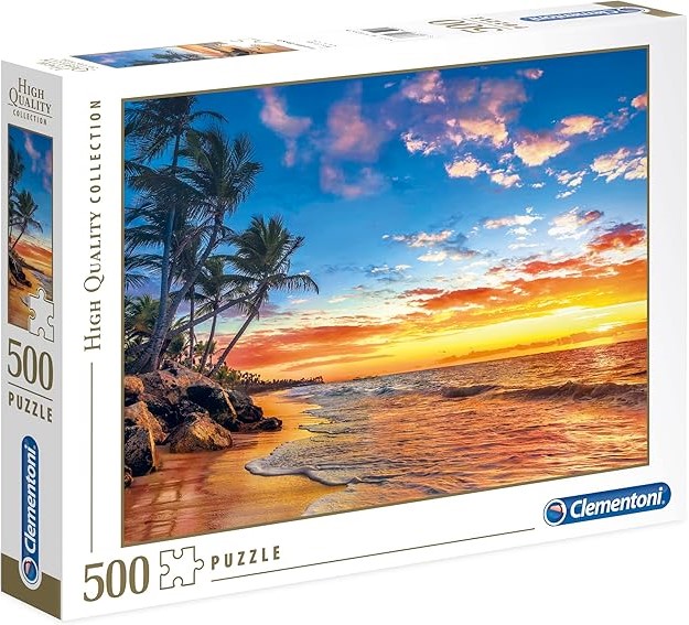 Box for a 500-piece jigsaw puzzle that shows a photograph of a tropical beach at sunset.