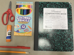 Various school supplies arranged on a table