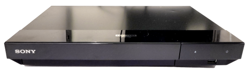 a black 4k ultra hd blu-ray player with a glossy top, sony logo, and various other labels on its side.