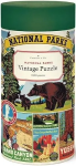 Cylindrical box for a jigsaw puzzle. The label on the front reads "National Parks Vintage Puzzle 1000 Pieces"