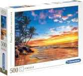 Box for a 500-piece jigsaw puzzle that shows a photograph of a tropical beach at sunset.