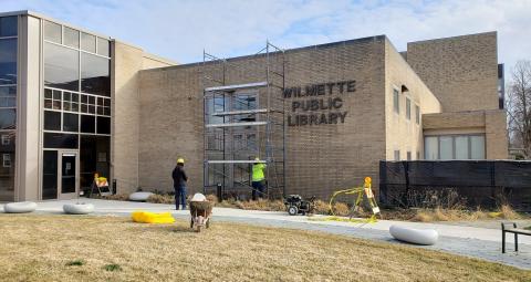 Crews working on the 2021 tuckpointing project on the building exterior. 