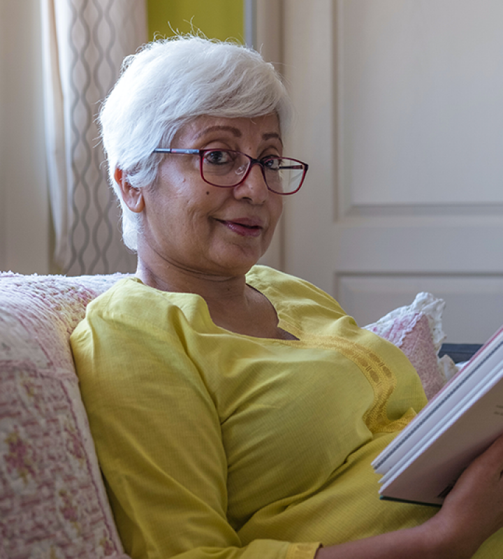 Adult Book Lists linked image showing older woman reading novel