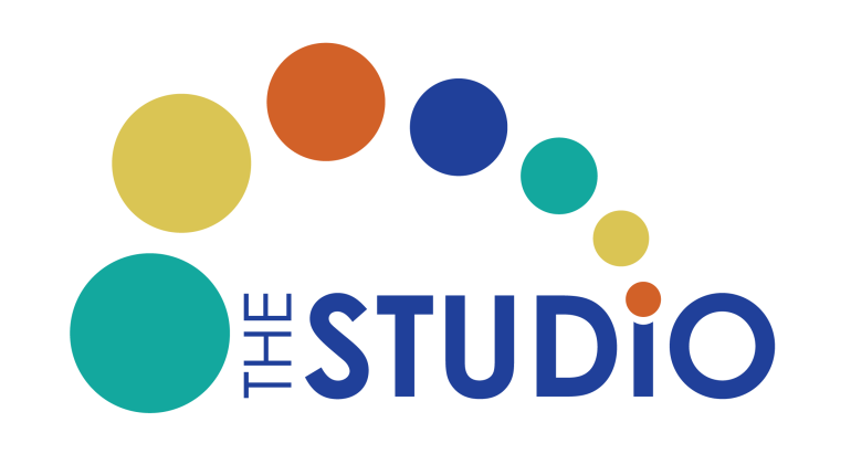 Logo for "The Studio" with colorful circles coming out of the dot above the "i" in Studio